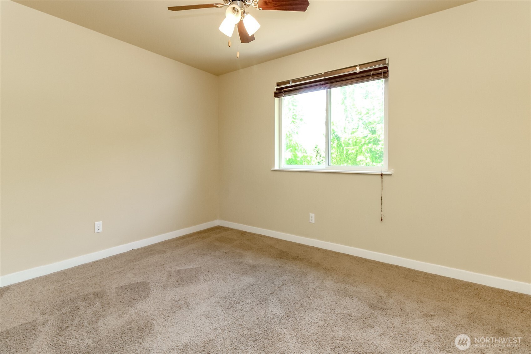 1605 Riddell Avenue Northeast Orting, WA 98360 - Photo 25 of 35 an empty room with a window