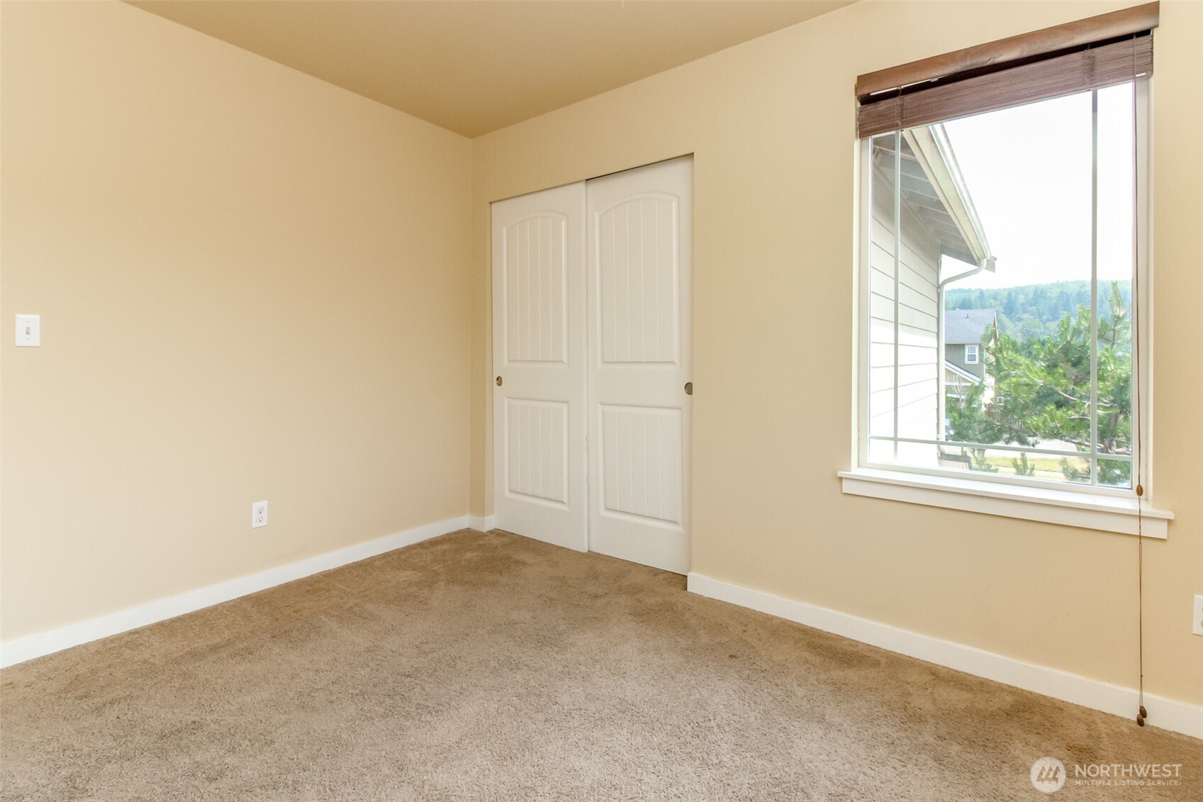 1605 Riddell Avenue Northeast Orting, WA 98360 - Photo 28 of 35 a view of an empty room with a window