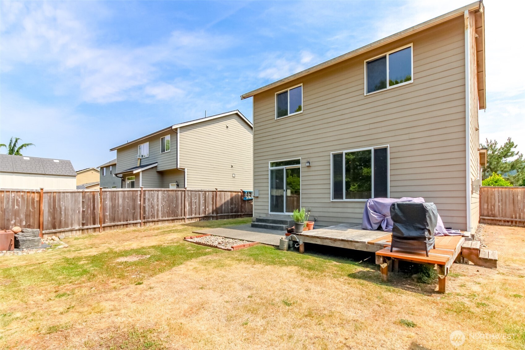 1605 Riddell Avenue Northeast Orting, WA 98360 - Photo 30 of 35 a view of a house with swimming pool and sitting area