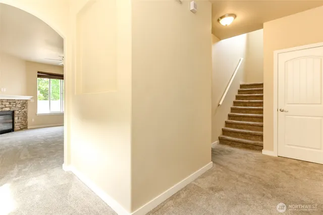 a view of entryway and hall with wooden floor