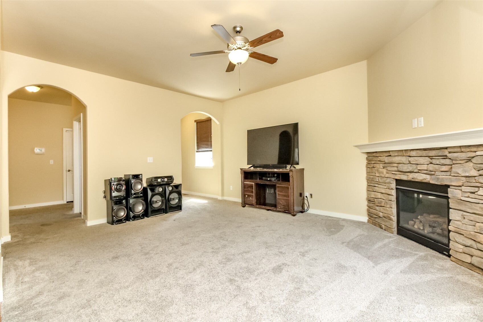 1605 Riddell Avenue Northeast Orting, WA 98360 - Photo 6 of 35 a living room with furniture and a fireplace