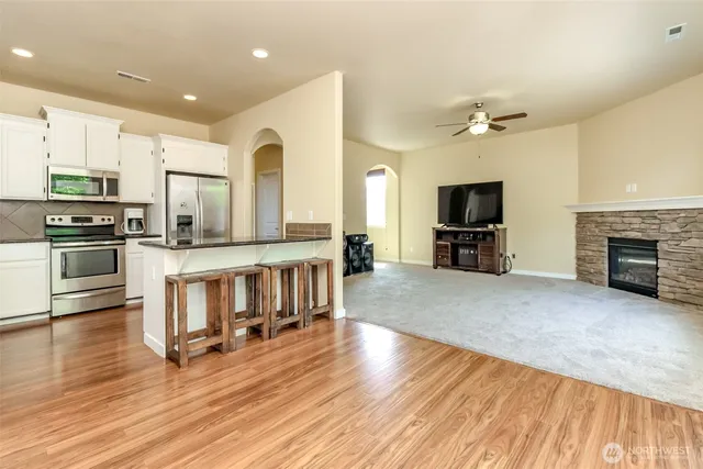 a living room with furniture and a fireplace