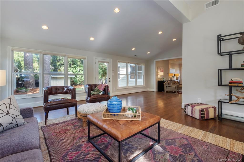 635 Marsh Road Charlotte, NC 28209 - Photo 16 of 48 a living room with furniture and a wooden floor