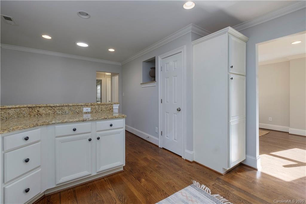 635 Marsh Road Charlotte, NC 28209 - Photo 22 of 48 a bathroom with a granite countertop sink and a mirror