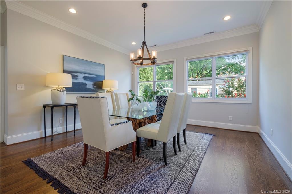 635 Marsh Road Charlotte, NC 28209 - Photo 28 of 48 a dining room with furniture a rug and wooden floor
