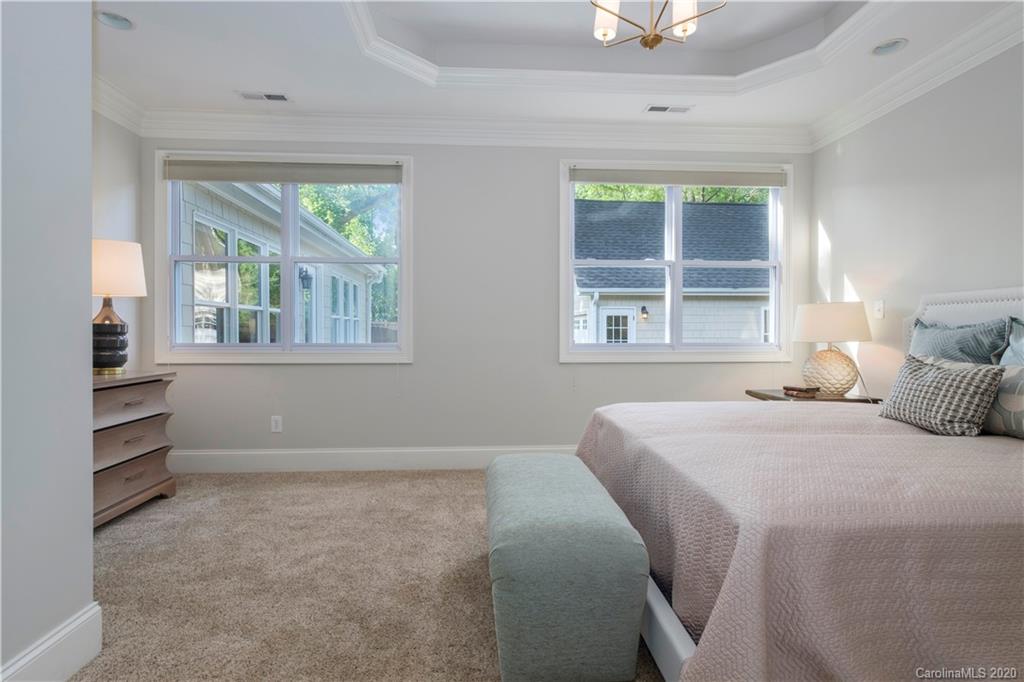 635 Marsh Road Charlotte, NC 28209 - Photo 32 of 48 a bedroom with a bed and a window