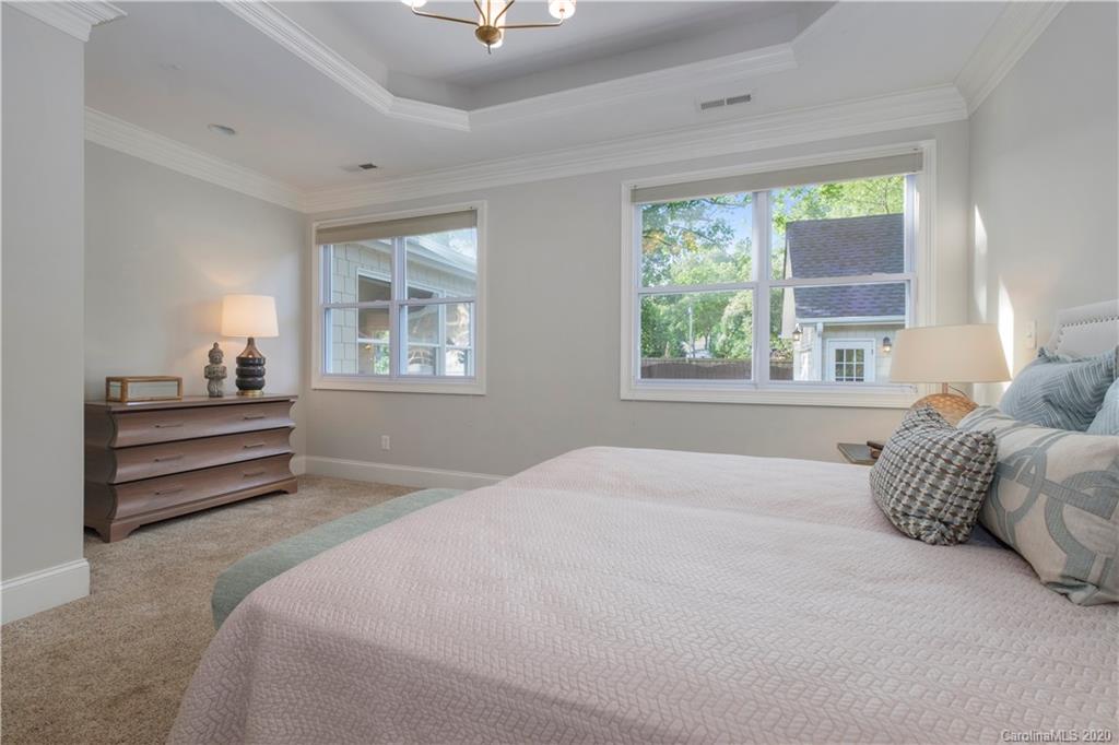 635 Marsh Road Charlotte, NC 28209 - Photo 35 of 48 a bedroom with a bed and a window