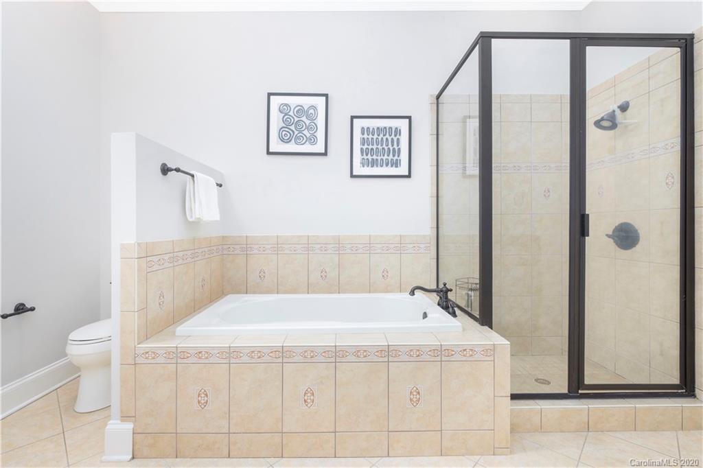 635 Marsh Road Charlotte, NC 28209 - Photo 37 of 48 a bathroom with a bathtub and a toilet