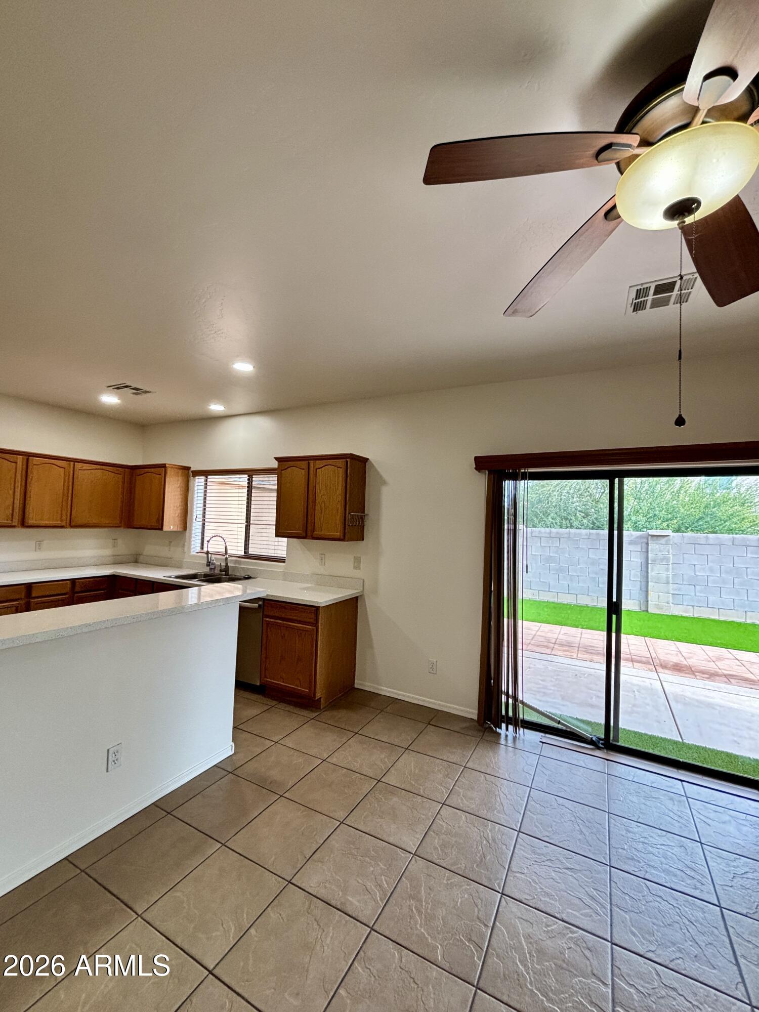 160 North Pottebaum Road Casa Grande, AZ 85122 - Photo 14 of 47 a kitchen with stainless steel appliances kitchen island granite countertop a sink and cabinets
