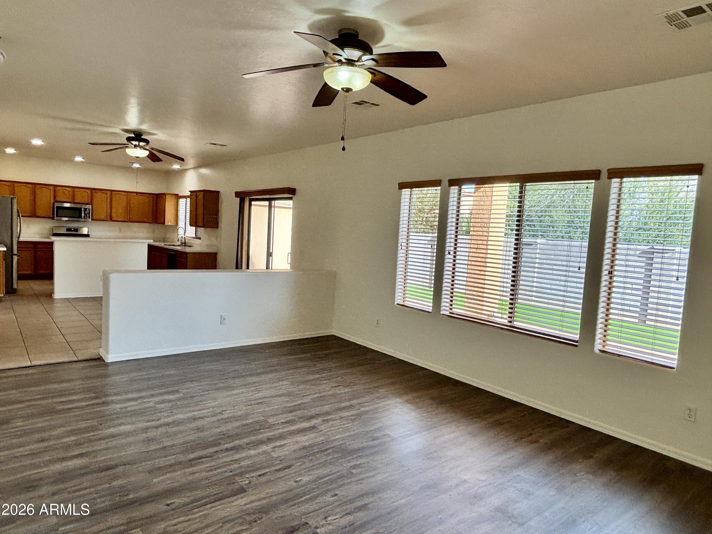160 North Pottebaum Road Casa Grande, AZ 85122 - Photo 18 of 47 a view of a livingroom with furniture a ceiling fan and hardwood floor
