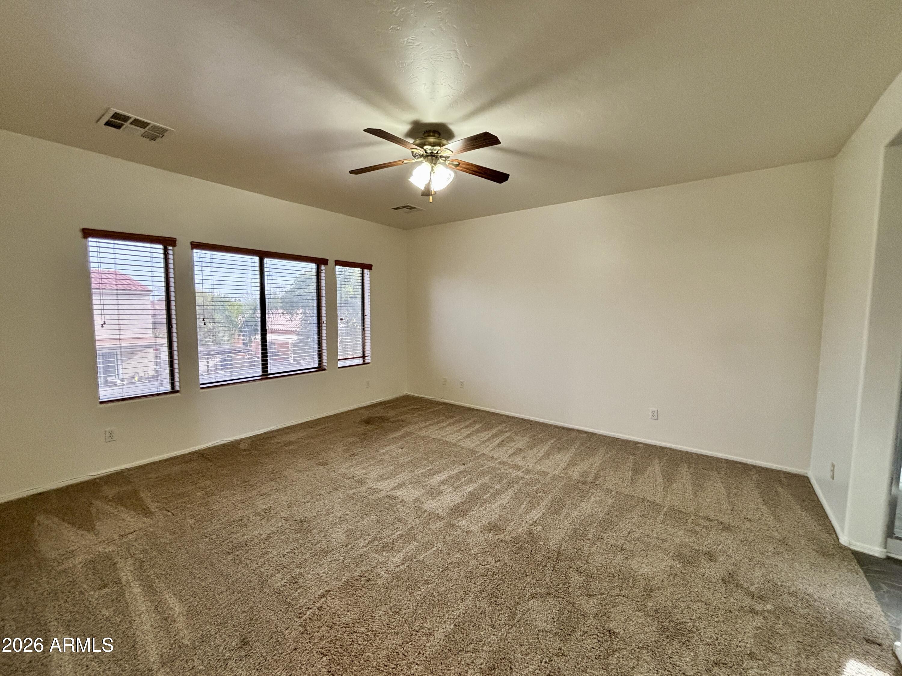 160 North Pottebaum Road Casa Grande, AZ 85122 - Photo 28 of 47 a view of an empty room with window and chandelier fan
