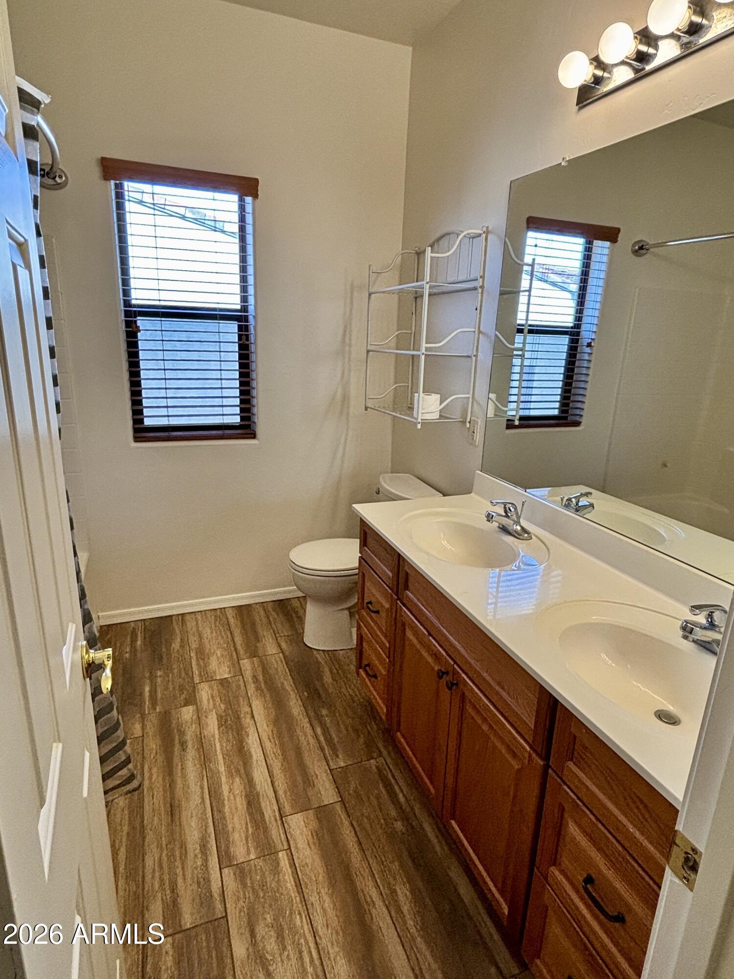160 North Pottebaum Road Casa Grande, AZ 85122 - Photo 39 of 47 a bathroom with a sink a toilet and mirror