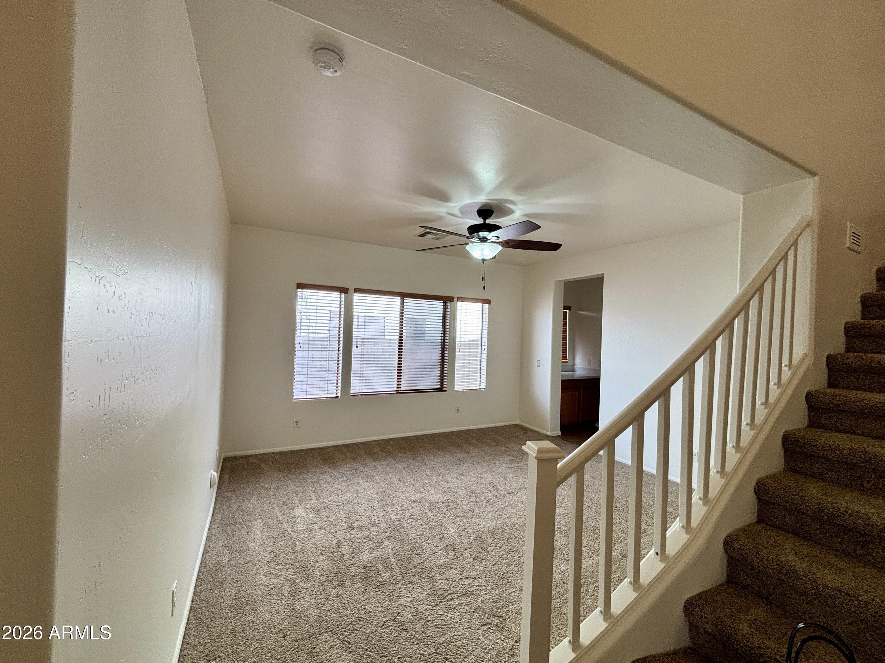 160 North Pottebaum Road Casa Grande, AZ 85122 - Photo 5 of 47 wooden floor in an empty room with a window