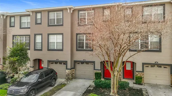 a front view of a house with many windows