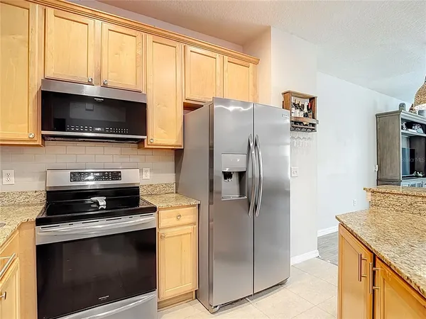 a kitchen with a granite countertop sink and a granite counter top