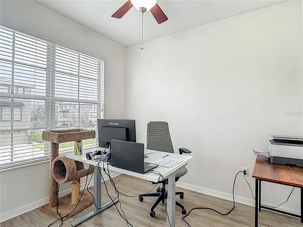 a view of a workspace with furniture