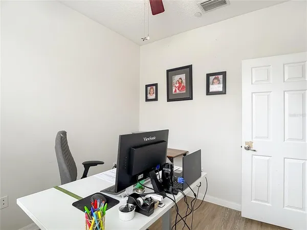 a view of a workspace with furniture