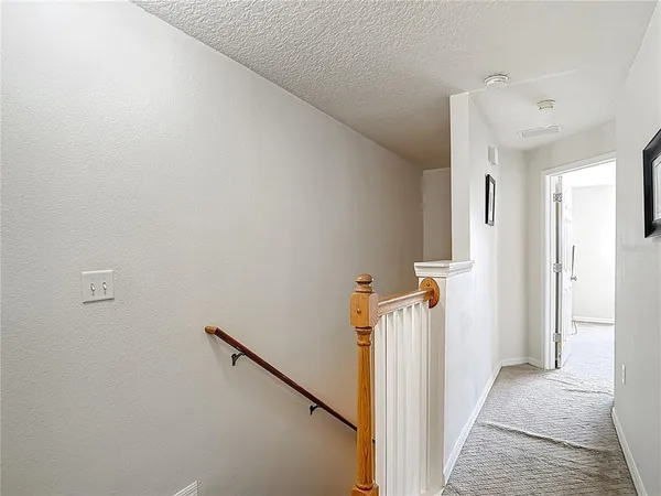 a bedroom with a bed and a ceiling fan