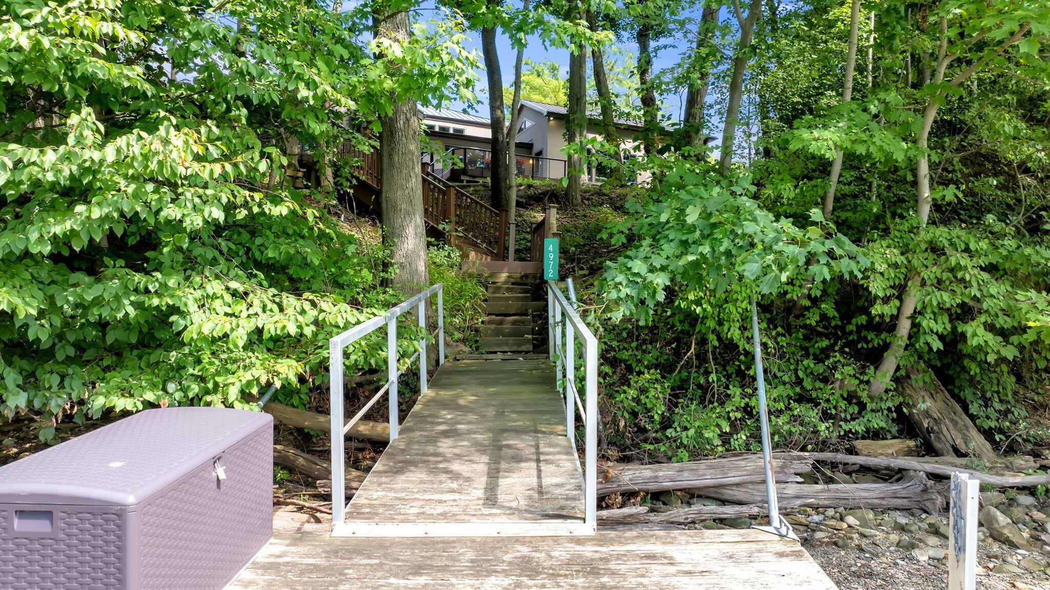 4972 Red Bank Road Galena, OH 43021 - Photo 83 of 123 Waterfront access featuring a wooden dock and stairway.