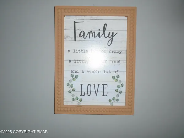 a view of a house with wooden fence