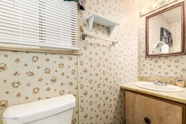a bathroom with a toilet and a sink