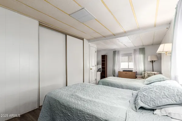 a bedroom with a bed and a dresser