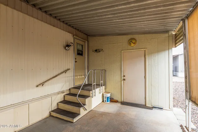 a view of a livingroom with wooden floor and stairs