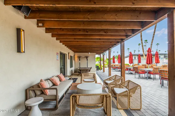 a dining room with furniture and a wooden floor