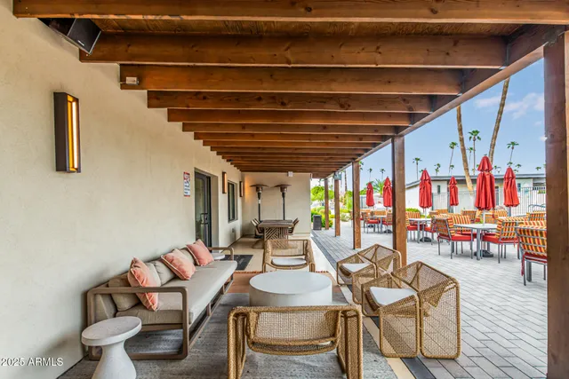a dining room with furniture and a wooden floor