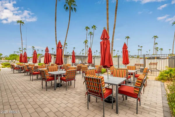 a view of group of sitting area with chairs