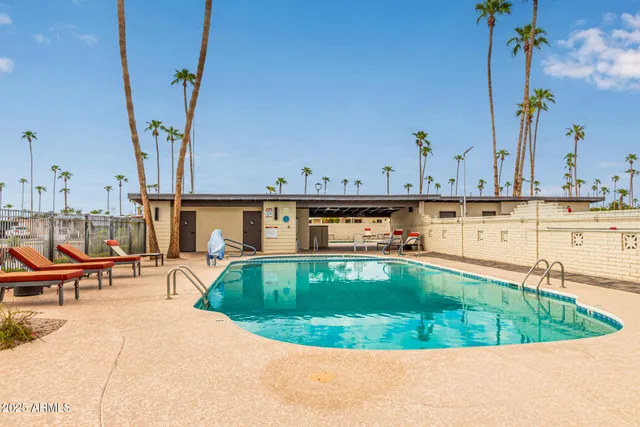 a view of a swimming pool with chairs