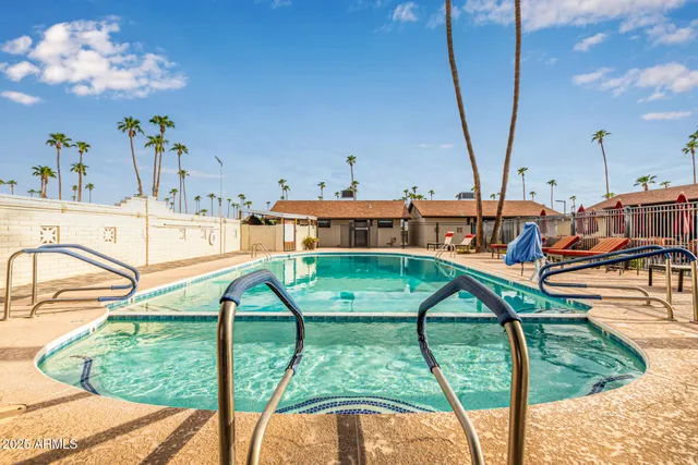 a view of a swimming pool with a lounge chairs