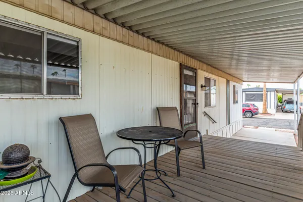 a view of a chairs and table in a patio