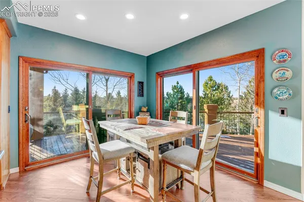 a view of a dining room with furniture window and wooden floor