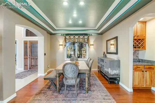 a view of a dining room with furniture window and wooden floor