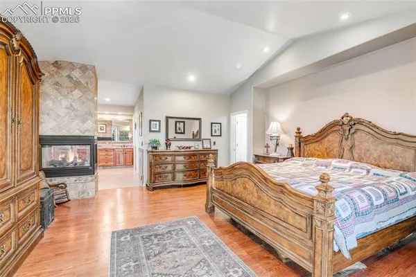 a bedroom with a bed and a view of bedroom