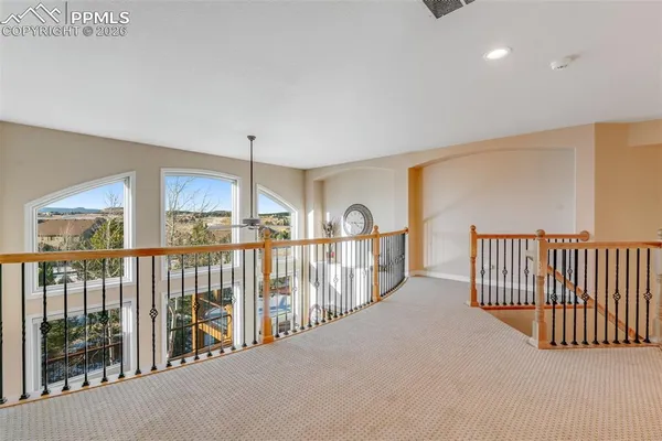 a view of a hallway with windows