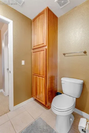 a bathroom with a toilet and a sink