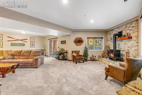 a living room with furniture and large windows
