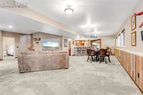a view of a livingroom with furniture and a flat screen tv