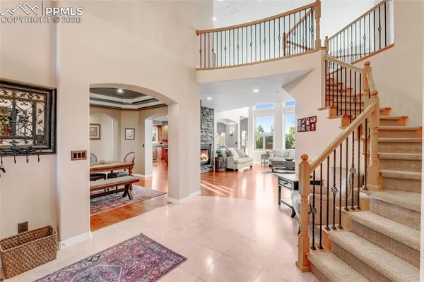 a view of a livingroom with furniture and staircase