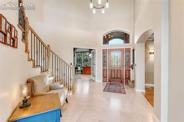 a view of entryway and hall with a front door