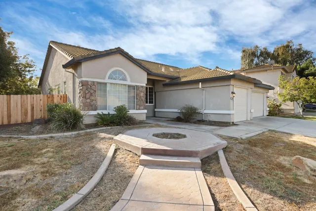 a front view of a house with entertaining space