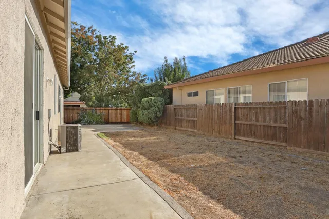 a view of backyard with cabin