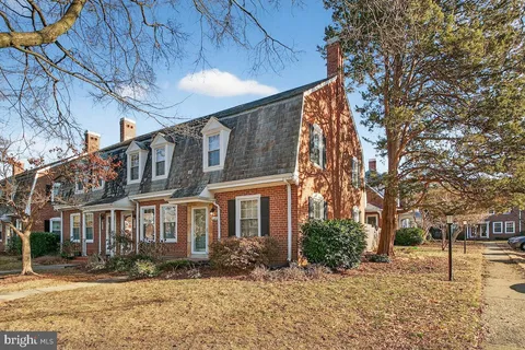 a view of a building with a yard