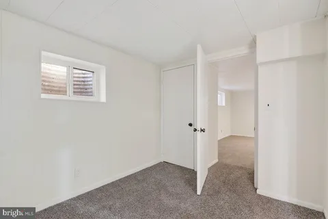 a bathroom with a toilet a sink and shower