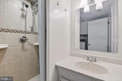 a view of a yard with wooden fence