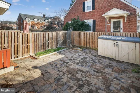 a front view of a residential apartment building with a yard