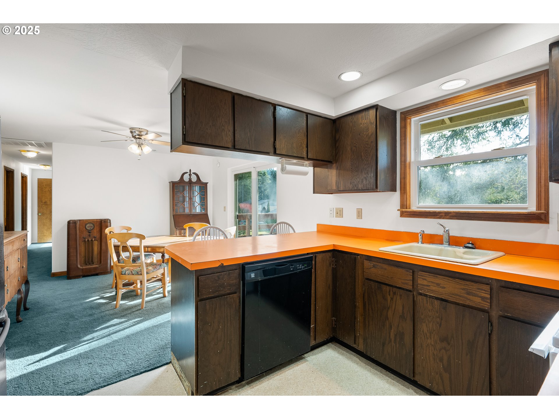1521 Ranch Road Reedsport, OR 97467 - Photo 12 of 44 a kitchen with stainless steel appliances kitchen island granite countertop a sink and cabinets
