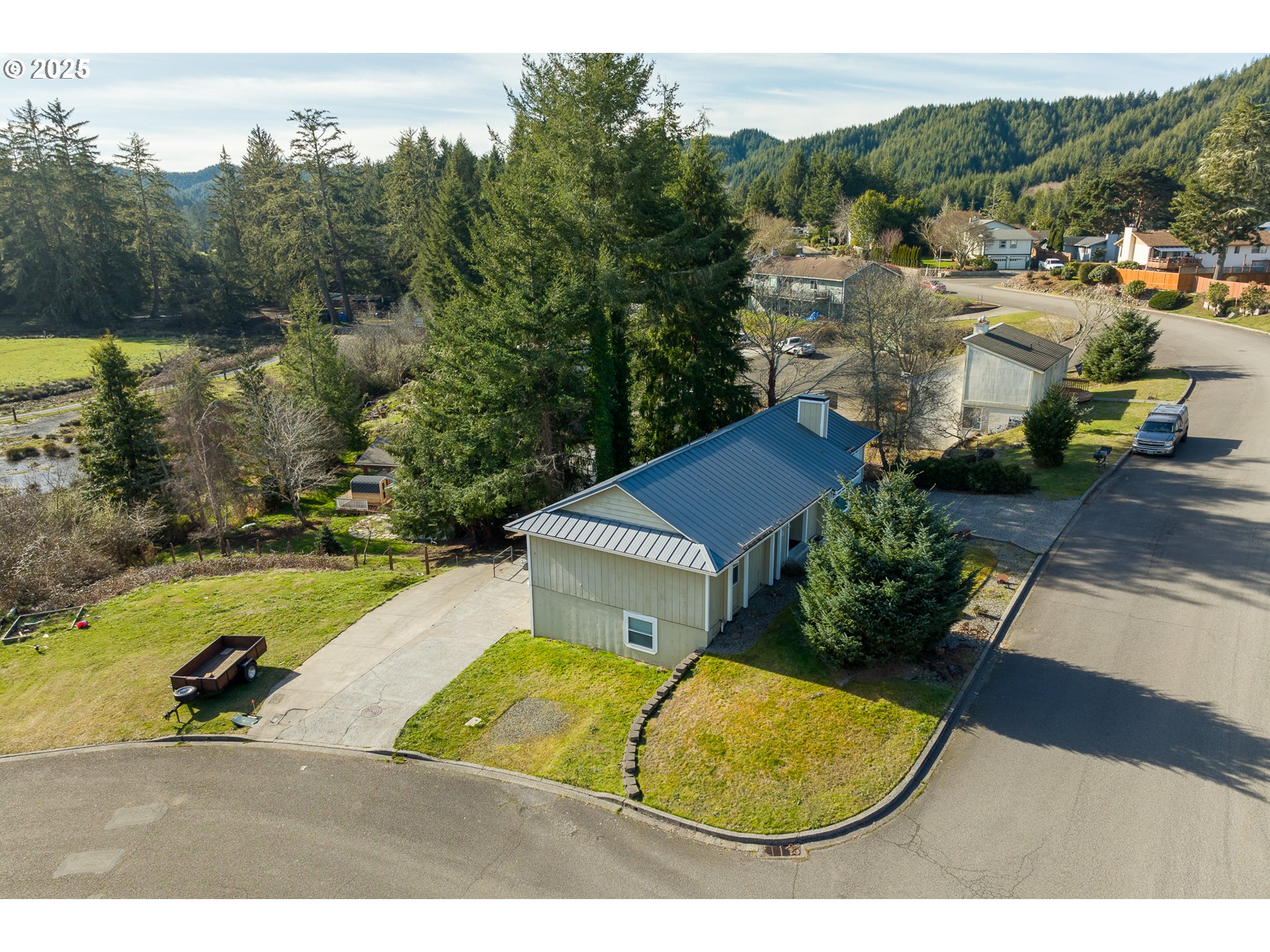 1521 Ranch Road Reedsport, OR 97467 - Photo 3 of 44 a view of a swimming pool with a yard and mountain view